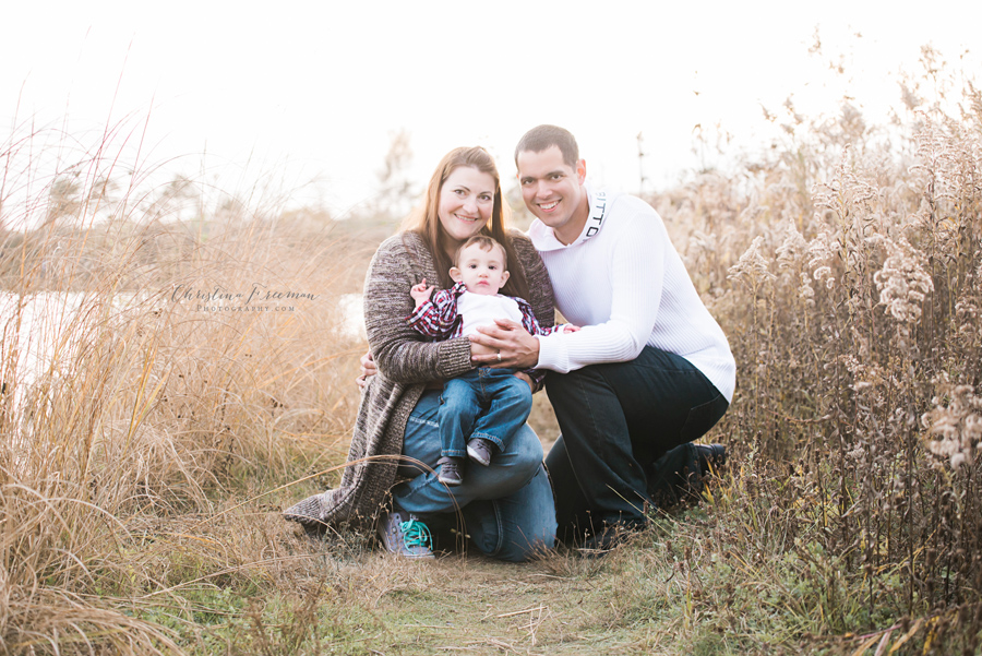 Family portrait in field. Family Photographer Christina Freeman Photography serving Northbrook, Glenview and Evanston