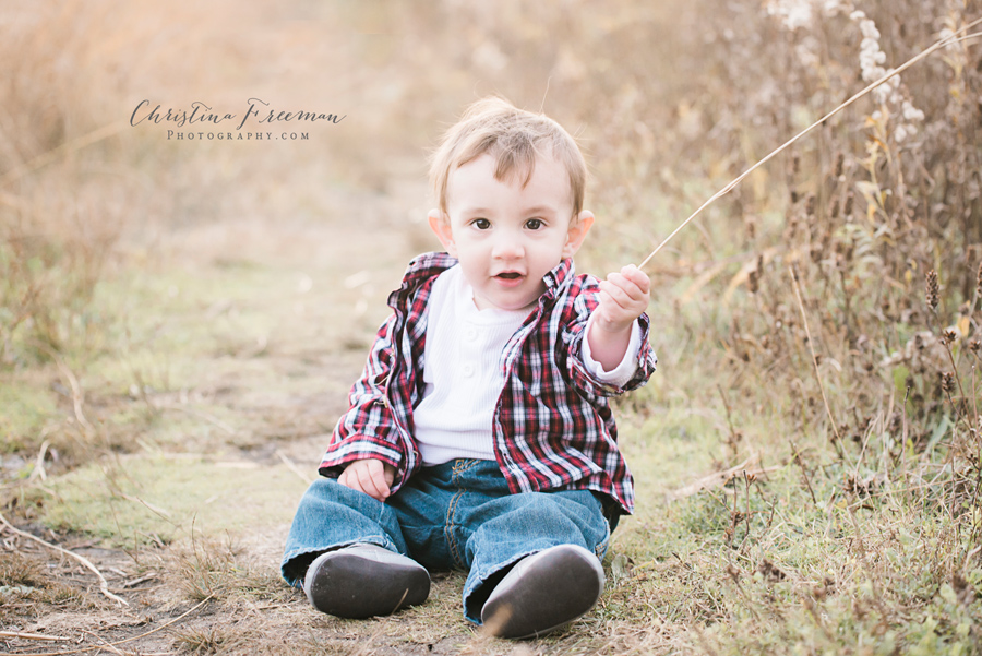 Baby boy in field.Family Photographer Christina Freeman Photography serving Northbrook, Glenview and Evanston